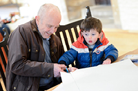 A grandfather and grandson enjoying family crafts at the National Civil War Centre